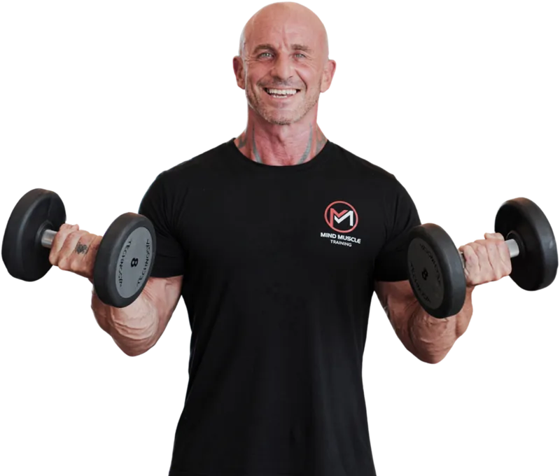 Ian, online fitness coach, holding dumbbells